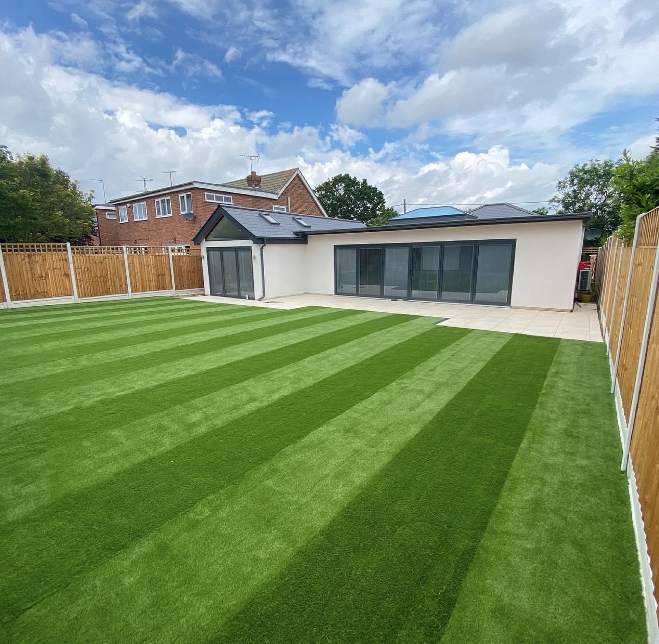 Landscaped garden with lawn, paving and planting